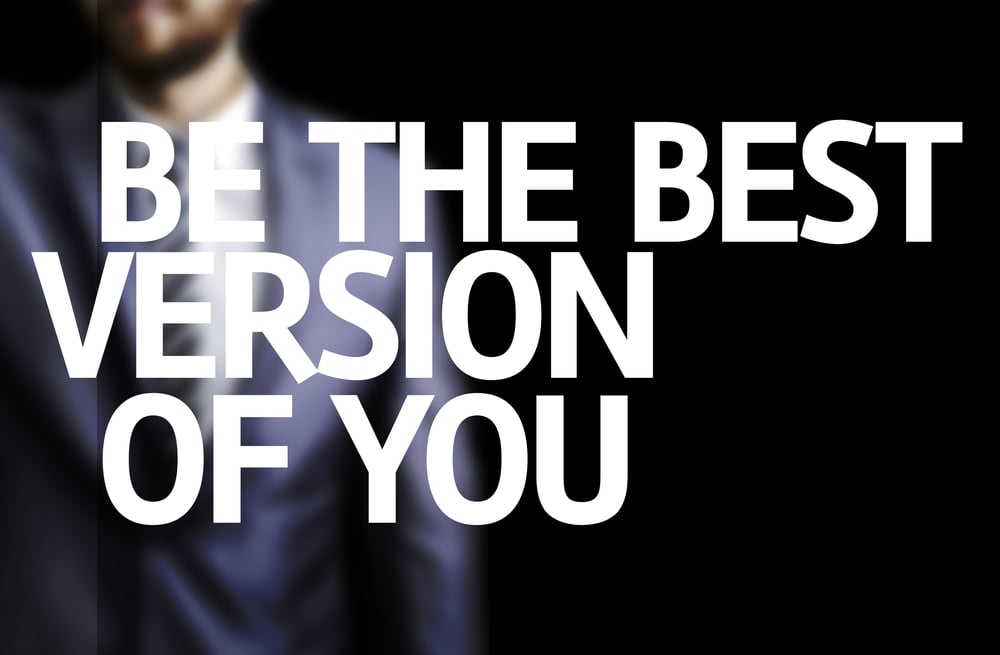 Be The Best Version Of You written on a board with a business man on background