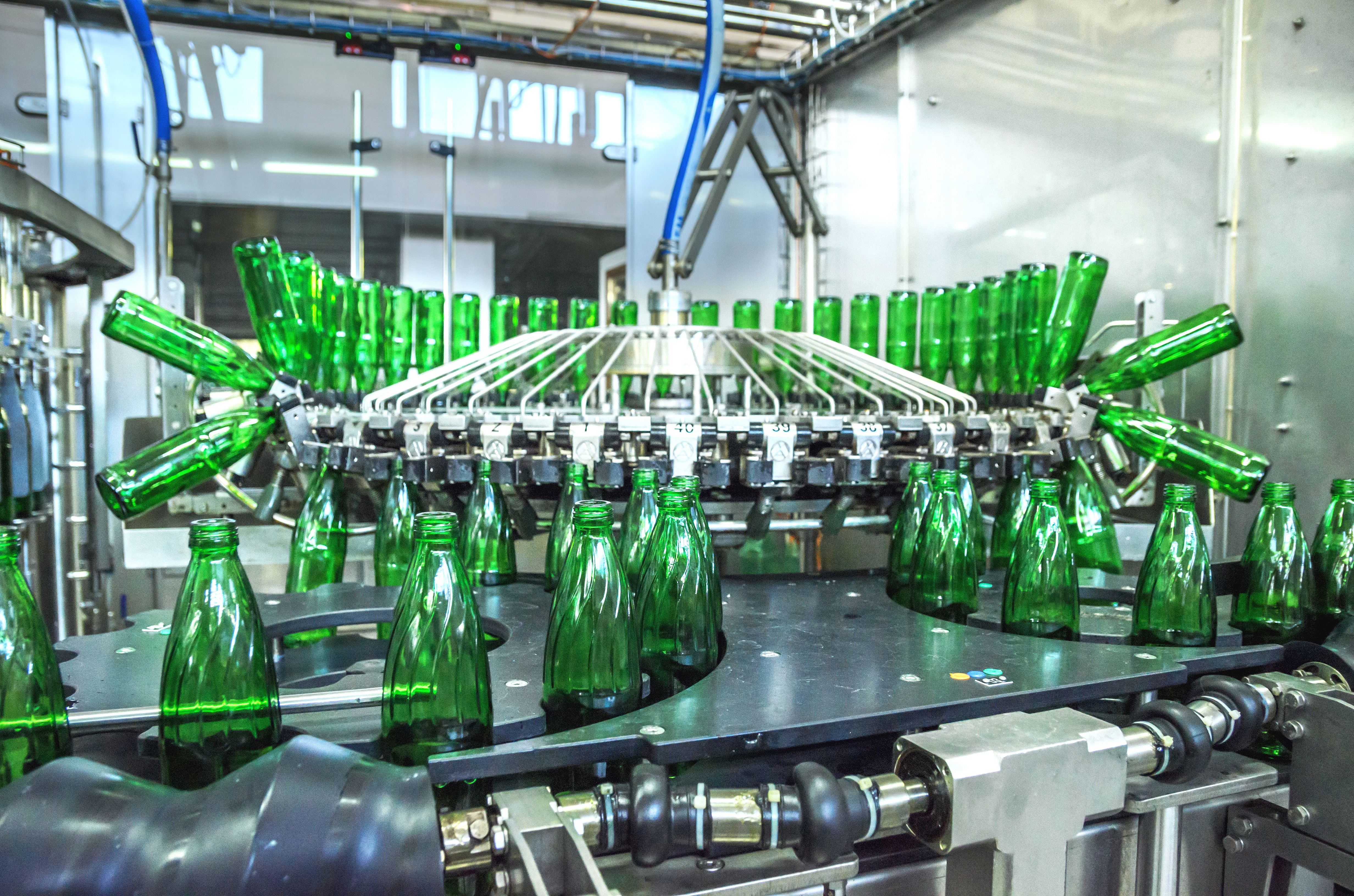 Green bottles on manufacturing line
